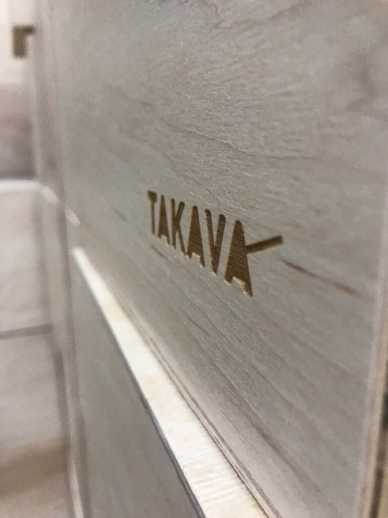 Лазерная гравировка логотипа TAKAVA на светлой фанере